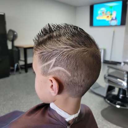 Young client's mohawk-style cut with design, Tomasso's Barber