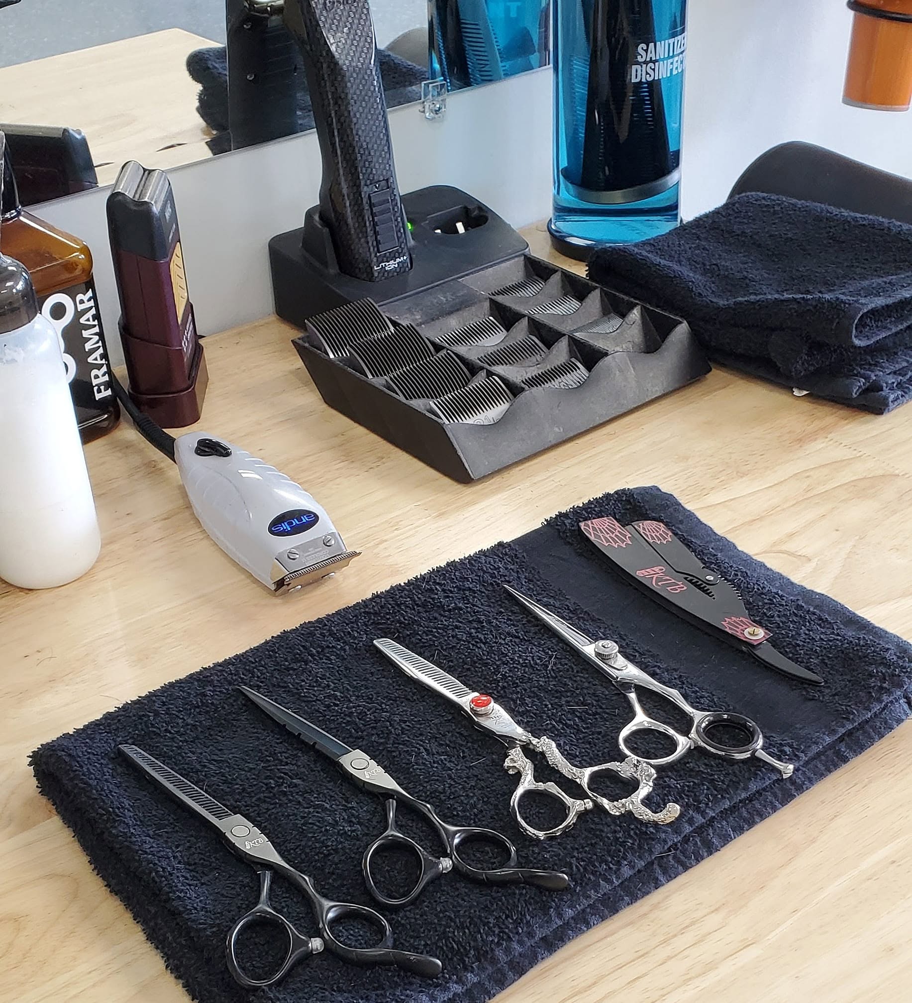 Barber's straight razors and shears laid out at Tomasso's, Turnersville NJ