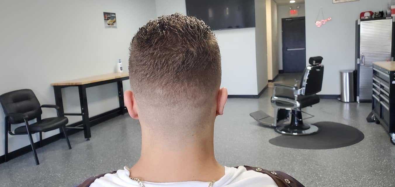 Crisp comb-over fade finished at Tomasso's Barber
