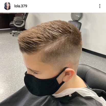 Kid's haircut with a hard part at Tomasso's Barber